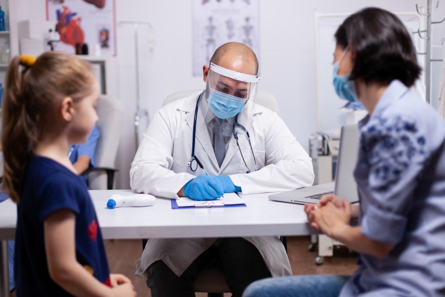 Child consulting a pediatrician during a medical examination